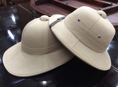 Lot 452 - Two pith helmets