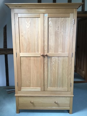 Lot 970 - Contemporary light oak wardrobe with twin doors and single drawer below