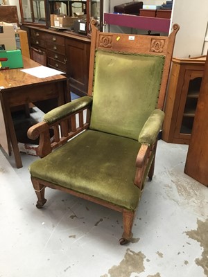 Lot 992 - Edwardian oak easy chair with green velvet upholstery on taper legs