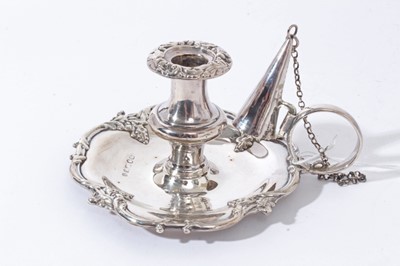 Lot 33 - Early Victorian silver taper chamberstick of shaped circular form with foliate scroll borders, loop handle with chain attached snuffer