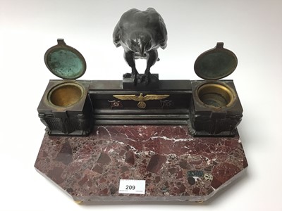 Lot 209 - Nazi Kreigsmarine bronze and marble desk stand, with central bronze Eagle on raised back set with Nazi badges above two inkwells, one shaped marble base raised on ball feet, 34cm in length