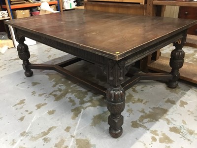 Lot 1002 - Edwardian Carolean revival oak extending dining table on cup and cover supports with two extra leaves opening to 285 x 122 cm