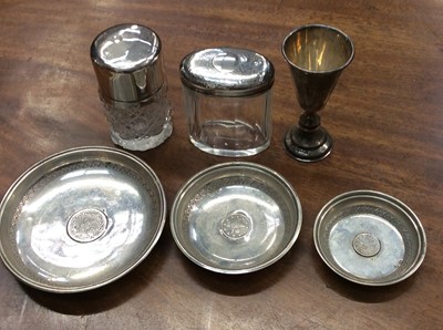 Lot 678 - Two silver topped glass jars, small silver beaker and three Eastern white metal pin dishes