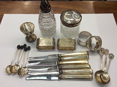 Lot 683 - Group silver to include four napkin rings, bean end coffee spoons, souvenir spoons, egg cup, silver handled knives, silver topped glass jar and sugar sifter