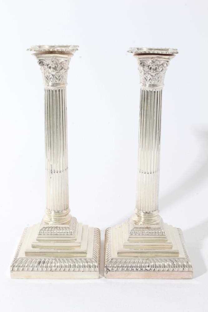 Lot 25 - Pair of George V silver Corinthian column candlesticks (London 1914), maker Goldsmiths & Silversmiths Company