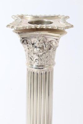 Lot 25 - Pair of George V silver Corinthian column candlesticks (London 1914), maker Goldsmiths & Silversmiths Company