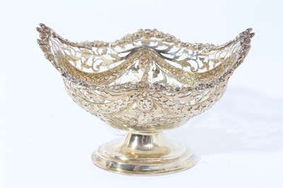 Lot 14 - Victorian silver gilt bon bon dish of navette form, with embossed swags and pierced decoration raised on oval pedestal foot, (Chester, marks rubbed), 6.4ozs, 15cm in length