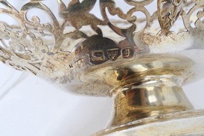 Lot 14 - Victorian silver gilt bon bon dish of navette form, with embossed swags and pierced decoration raised on oval pedestal foot, (Chester, marks rubbed), 6.4ozs, 15cm in length