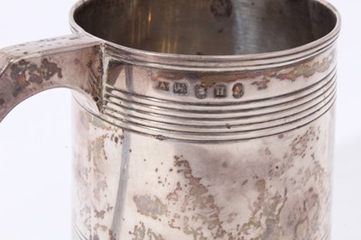 Lot 23 - George III silver christening mug of tapered form with ribbed bands and loop handle (London 1803), 5ozs