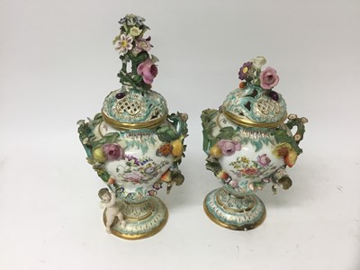 Lot 236 - Pair of Coalport style mid 19th century foliate encrusted urns and covers