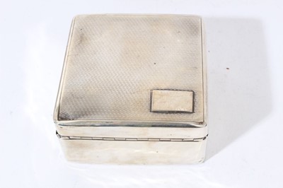 Lot 104 - George V silver cigarette box of rectangular form with domed hinged cover, (London 1920), together with another of square form (Birmingham 1927)