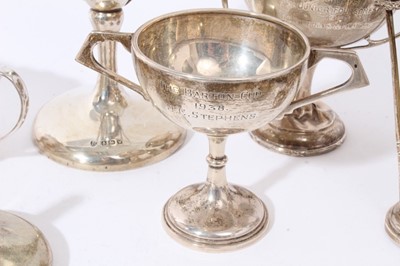 Lot 105 - Contemporary silver sauce boat of helmet form (Sheffield 1962), maker Viners, together with four silver Golf trophies cups