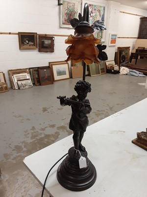 Lot 281 - Spelter figural table lamp in the form of a girl playing the flute with amber glass shade