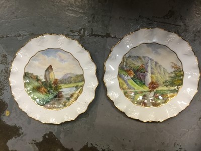 Lot 233 - Pair of early 20th century Royal Crown Derby painted porcelain plates by W. E. J. Dean, with titled scenes of Dovedale