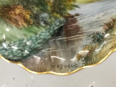 Lot 247 - Pair of early 20th century Royal Crown Derby painted porcelain plates by W. E. J. Dean, with titled scenes of Dovedale