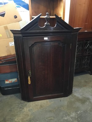 Lot 1018 - 18 th century oak hanging corner cupboard with shaped shelves and panelled door with broken pediment above