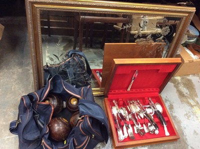 Lot 486 - Gilt framed bevelled wall mirror with butterfly decoration to plate, canteen plated cutlery and bag of wooden boules