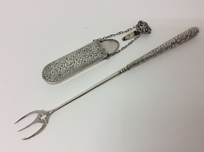Lot 195 - Victorian silver spectacles case with engraved foliate decoration, together with a Victorian silver handled toasting fork (2)