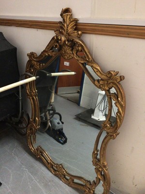 Lot 1041 - Good quality wall mirror in shaped ornate gilt frame, embroidered screen and a footstool