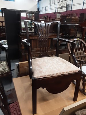 Lot 1044 - Georgian mahogany commode elbow chair