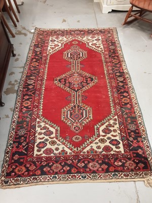 Lot 1050 - Eastern rug with geometric decoration on red, blue and cream ground