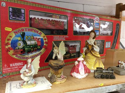 Lot 317 - Two Royal Doulton figures, fairy ornaments, Silver Jubilee 1977 horse and carriage and Northpole Holiday Express train set, boxed
