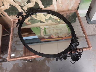 Lot 1056 - Pair of oval mirrors in black metal frames