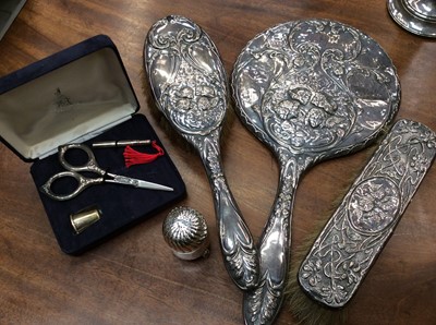 Lot 700 - Silver backed three piece dressing table items, silver pepperette and silver sewing kit in case