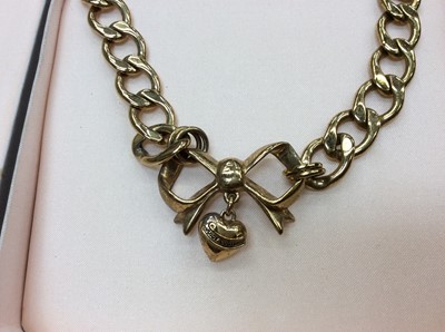 Lot 706 - Juicy Couture gilt metal necklace and matching bracelet with bow and heart decoration and one other bracelet with heart charm
