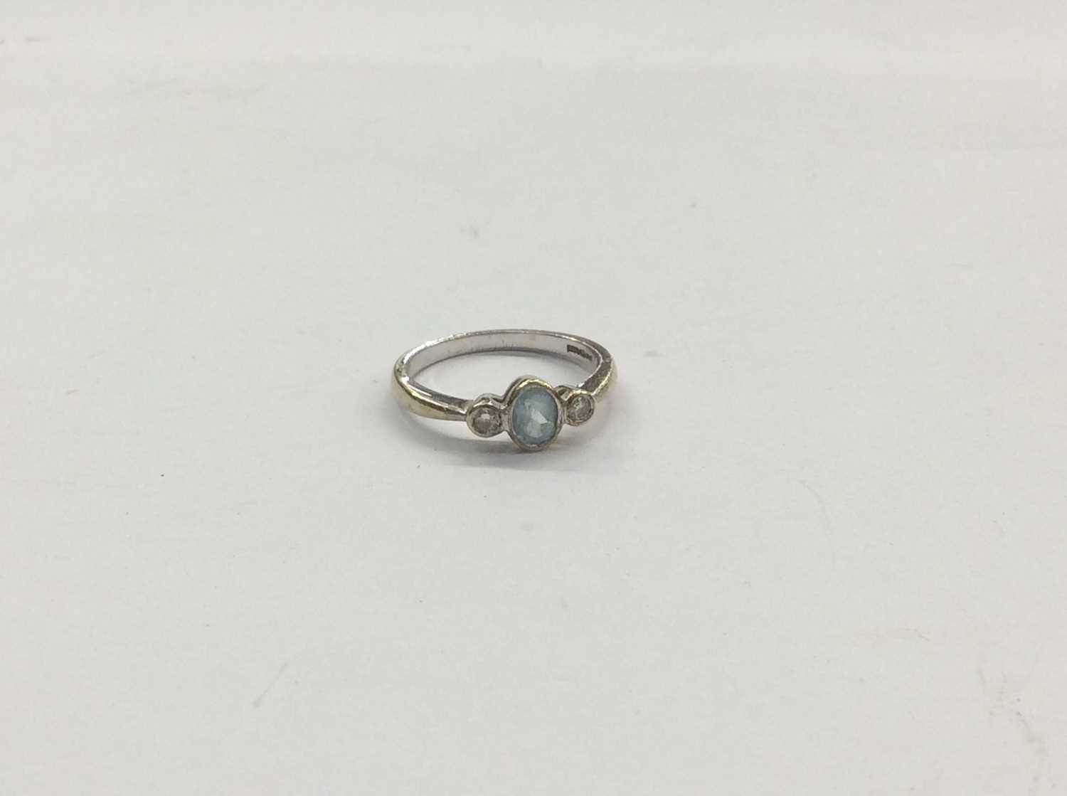 Lot 717 - 9ct white gold aquamarine and diamond three stone ring