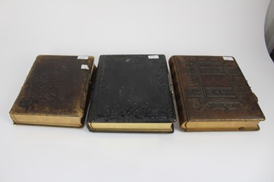 Lot 1173 - Four Victorian embossed leather photograph albums one with hand-painted floral illustrated pages. Containing a quantity of Carte de Visite, Cabinet cards and photographs.