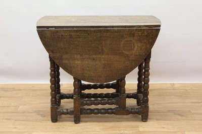 Lot 646 - Late 17th century oak oval gateleg dining table with end drawer on bobbin turned legs