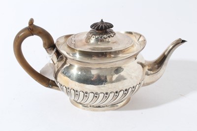 Lot 42 - Victorian silver teapot of oval half reeded form with fruitwood knop and handle and engraved crest (London 1892), all at 20ozs