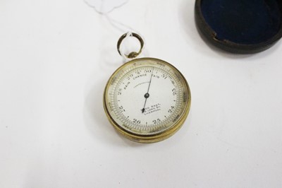 Lot 1862 - Two early 20th century brass cased pocket barometers with compasses, one signed Wood Bros. Liverpool, both in original leather covered cases