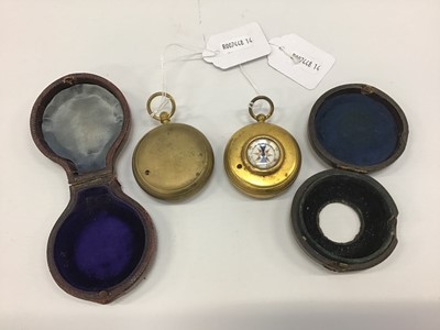 Lot 1862 - Two early 20th century brass cased pocket barometers with compasses, one signed Wood Bros. Liverpool, both in original leather covered cases