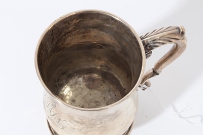 Lot 24 - George II silver tankard of baluster form with engraved inscription and initials 'John Nichols 1881', with scroll handle, on circular foot, (London 1757)