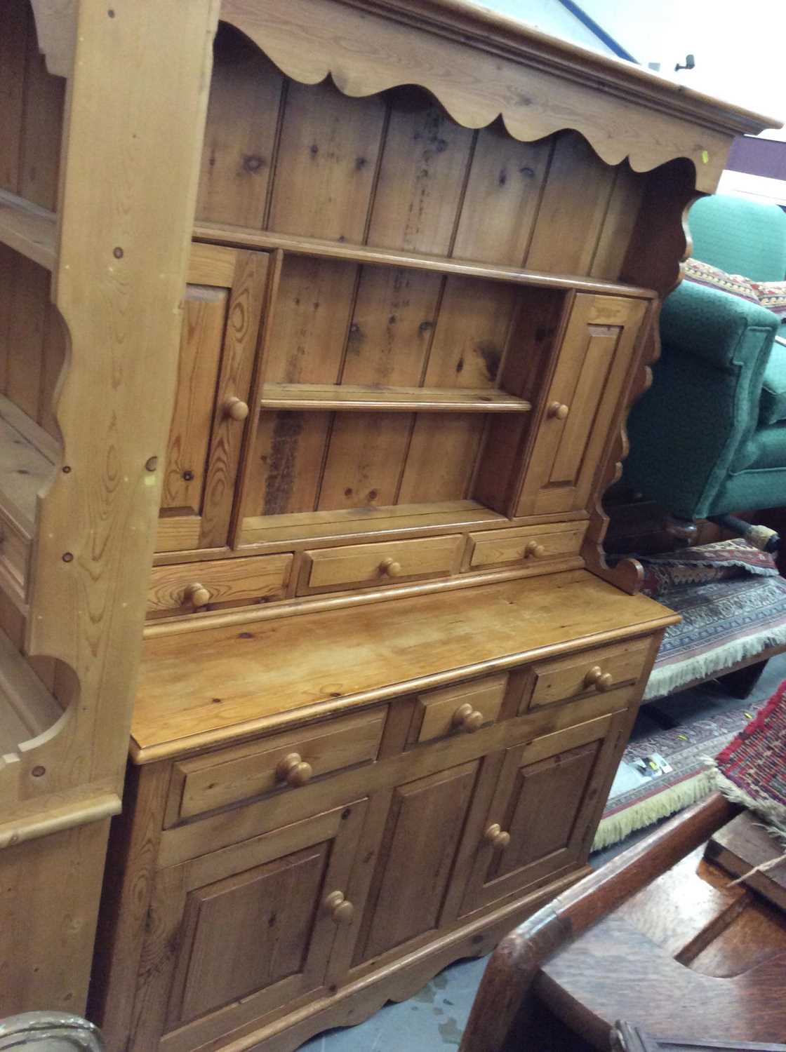 Lot 938 - Pine two height dresser with three cupboard doors and draws below