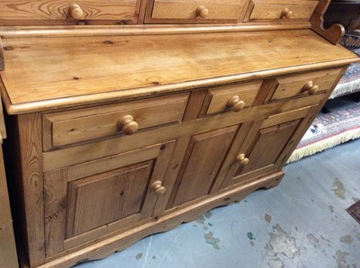 Lot 938 - Pine two height dresser with three cupboard doors and draws below