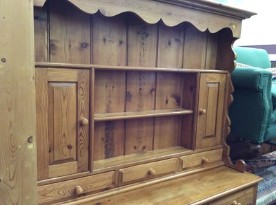 Lot 938 - Pine two height dresser with three cupboard doors and draws below