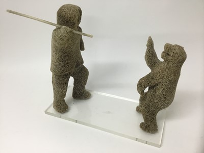 Lot 285 - Inuit marine whalebone carving of a figure and polar bear, perspex base