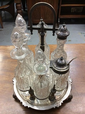 Lot 716 - Victorian silver plated six bottle cruet frame with cut glass bottles