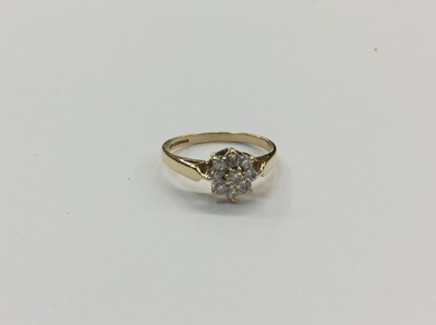 Lot 654 - 18ct gold diamond flower head cluster ring