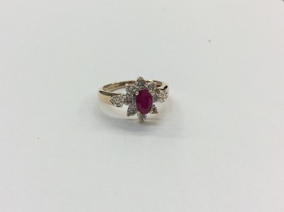 Lot 655 - 9ct gold ruby and diamond flower head cluster ring