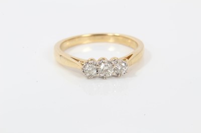 Lot 229 - 18ct gold diamond three stone ring, 0.25cts