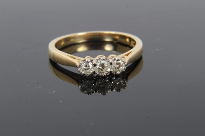 Lot 229 - 18ct gold diamond three stone ring, 0.25cts