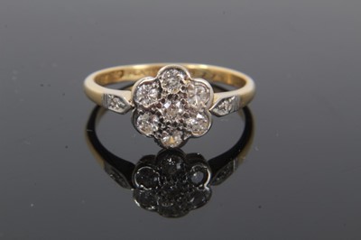 Lot 230 - 18ct gold dimoand flower head cluster ring