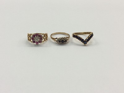 Lot 700 - 9ct gold ruby cluster ring and two 9ct gold sapphire rings (3)