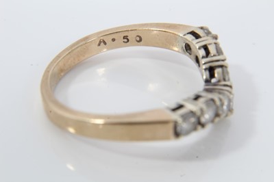 Lot 21 - 9ct gold diamond seven stone wishbone ring
