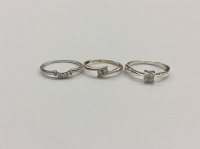 Lot 704 - Two 9ct gold diamond set rings and diamond set silver ring (3)