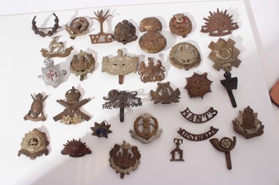 Lot 256 - Group of First World War and later military cap badges, two silver war badges and various military and other buttons